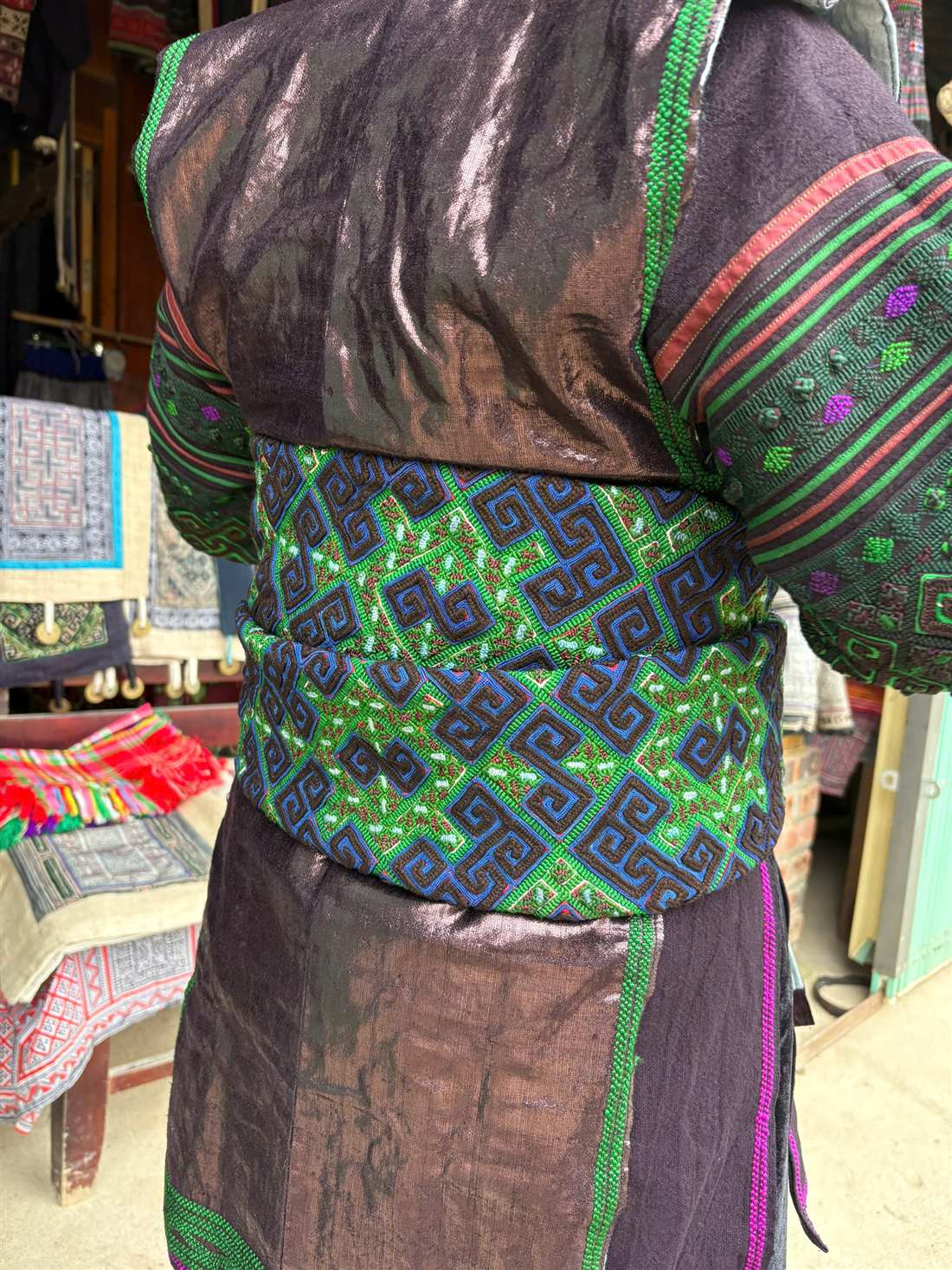 Hmong embroidered belt and jacket detail